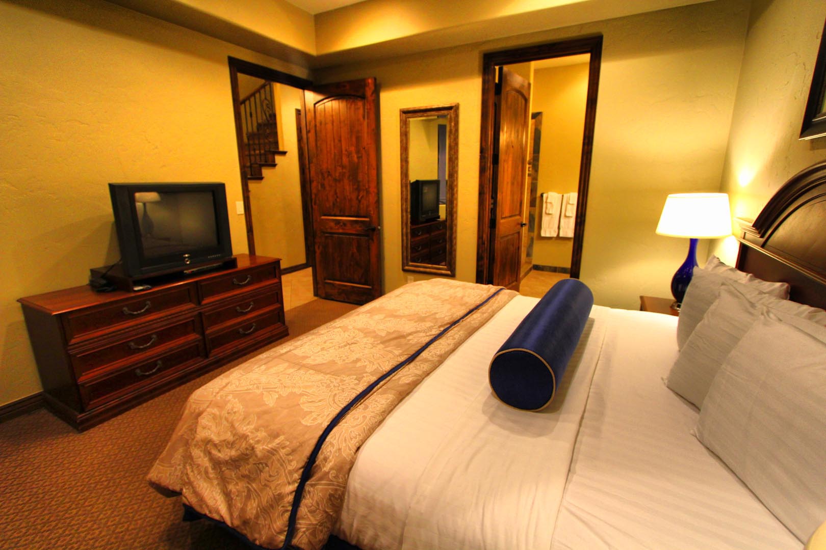 A spacious master bedroom at VRI's Canyon Villas at Coral Ridge in Washington, Utah.